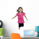 Adorable little girl jumping in air. isolated on white backgrou Wall Decal