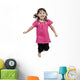 Adorable little girl jumping in air. isolated on white backgrou Wall Decal