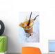 Cold coffee drink with ice and splashes Wall Mural