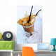 Cold coffee drink with ice and splashes Wall Mural