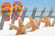 starfish by flip flops Wall Mural