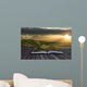 Magical book with contents spilling into landscape background Wall Mural
