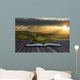 Magical book with contents spilling into landscape background Wall Mural