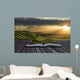 Magical book with contents spilling into landscape background Wall Mural