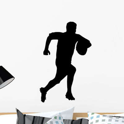 Sport Silhouette Rugby Football Wall Decal shown on a wall
