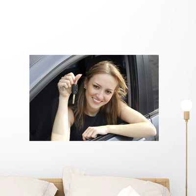 Happy Woman Showing Key Wall Decal shown on a wall