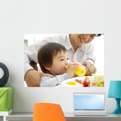 Boy Drinking Orange Juice shown on a wall