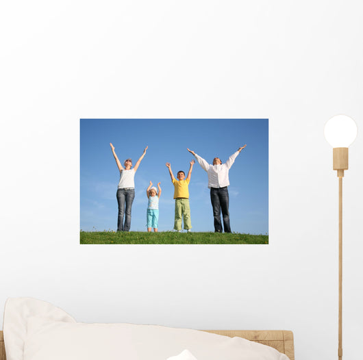 family  with hands up Wall Mural