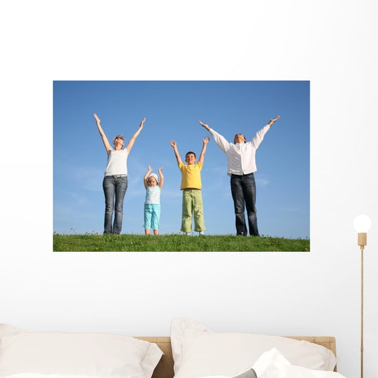 family  with hands up Wall Mural