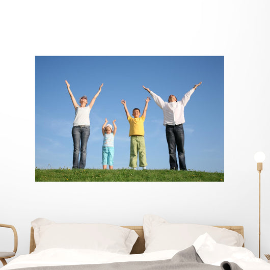 family  with hands up Wall Mural
