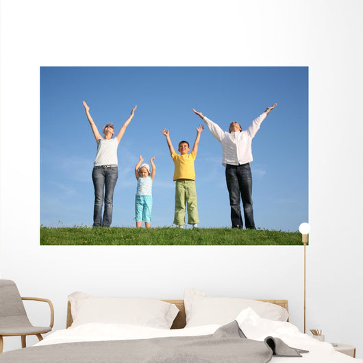 family  with hands up Wall Mural
