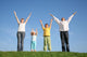 family  with hands up Wall Mural