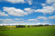 farmland with blue and cloudy sky Wall Mural