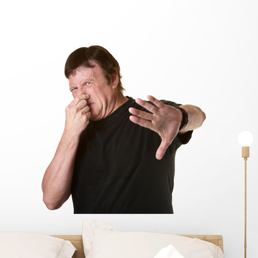 Man Pinches His Nose