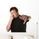 Man Pinches His Nose