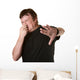 Man Pinches His Nose