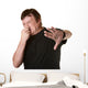 Man Pinches His Nose