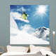 Snowboarder at jump inhigh mountains Wall Mural