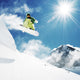 Snowboarder at jump inhigh mountains Wall Mural