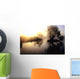 dramatic sunrise over a misty lake at dawn Wall Mural