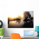 dramatic sunrise over a misty lake at dawn Wall Mural