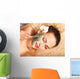 Young woman  having clay body mask. Wall Mural