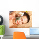 Young woman  having clay body mask. Wall Mural