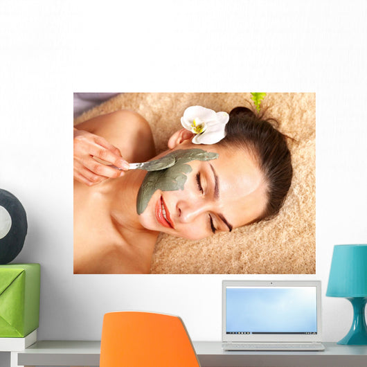 Young woman  having clay body mask. Wall Mural