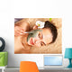 Young woman  having clay body mask. Wall Mural