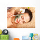 Young woman  having clay body mask. Wall Mural
