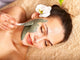 Young woman  having clay body mask. Wall Mural