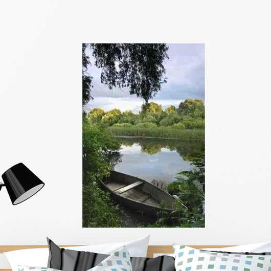 Boat Pulled Onto the Shore of a River Wall Decal