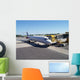 a number of airline aeroplanes at a busy airport Wall Mural
