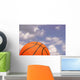 Orange Basketball against Cloudy Wall Mural