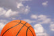 Orange Basketball against Cloudy Wall Mural