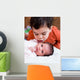 Young Boy Talking to His Newborn Sister Wall Mural