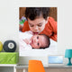 Young Boy Talking to His Newborn Sister Wall Mural