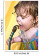 a toddler drinking water from a garden hose Wall Mural