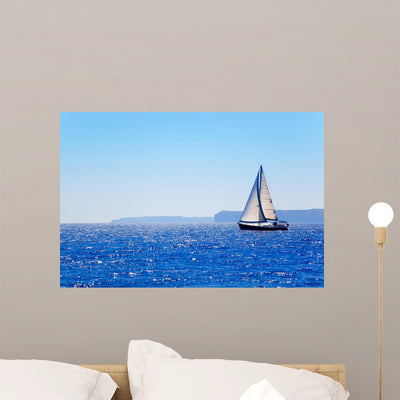Blue Mediterranean Sailboat Sailing shown on a wall