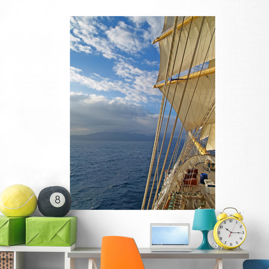 Tall ship under sails in the sea Wall Mural