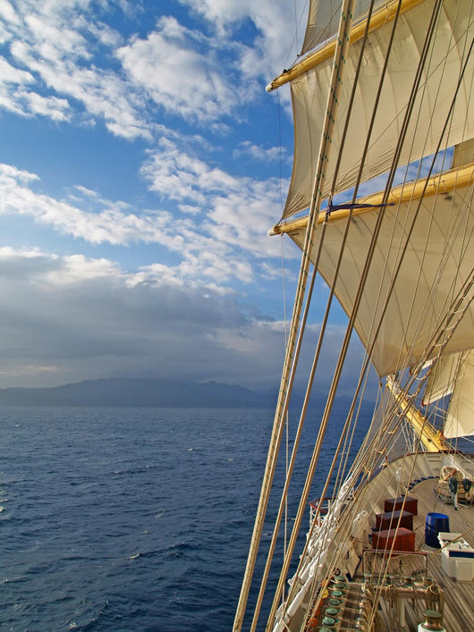Tall ship under sails in the sea Wall Mural