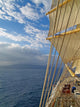Tall ship under sails in the sea Wall Mural