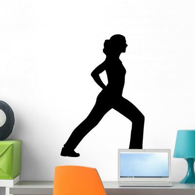 Exercise Silhouette Wall Decal shown on a wall