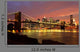 Brooklyn Bridge with city skyline at night Wall Mural