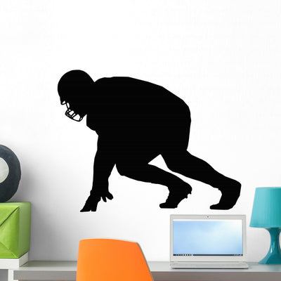 Silhouette American Football Player Wall Decal shown on a wall