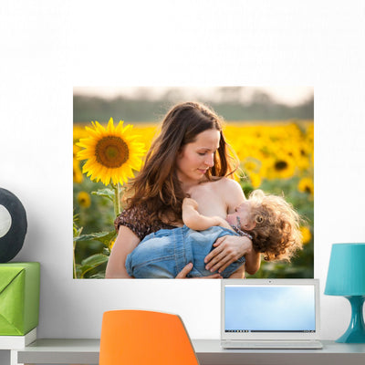 Woman Breastfeeding Baby Wall Decal shown on a wall