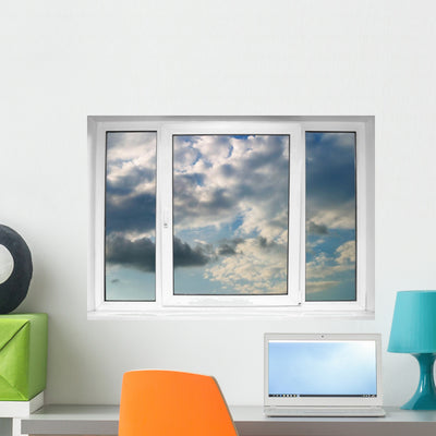 Cloudy Storm Clouds Window Wall Decal shown on a wall