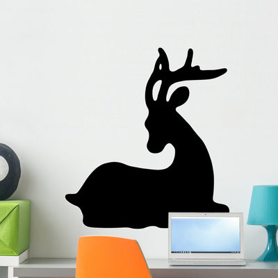 Deer Silhouette Wall Decal shown on a wall