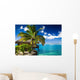 Tropical bungalow and palm tree next to amazing lagoon Wall Mural
