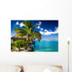 Tropical bungalow and palm tree next to amazing lagoon Wall Mural